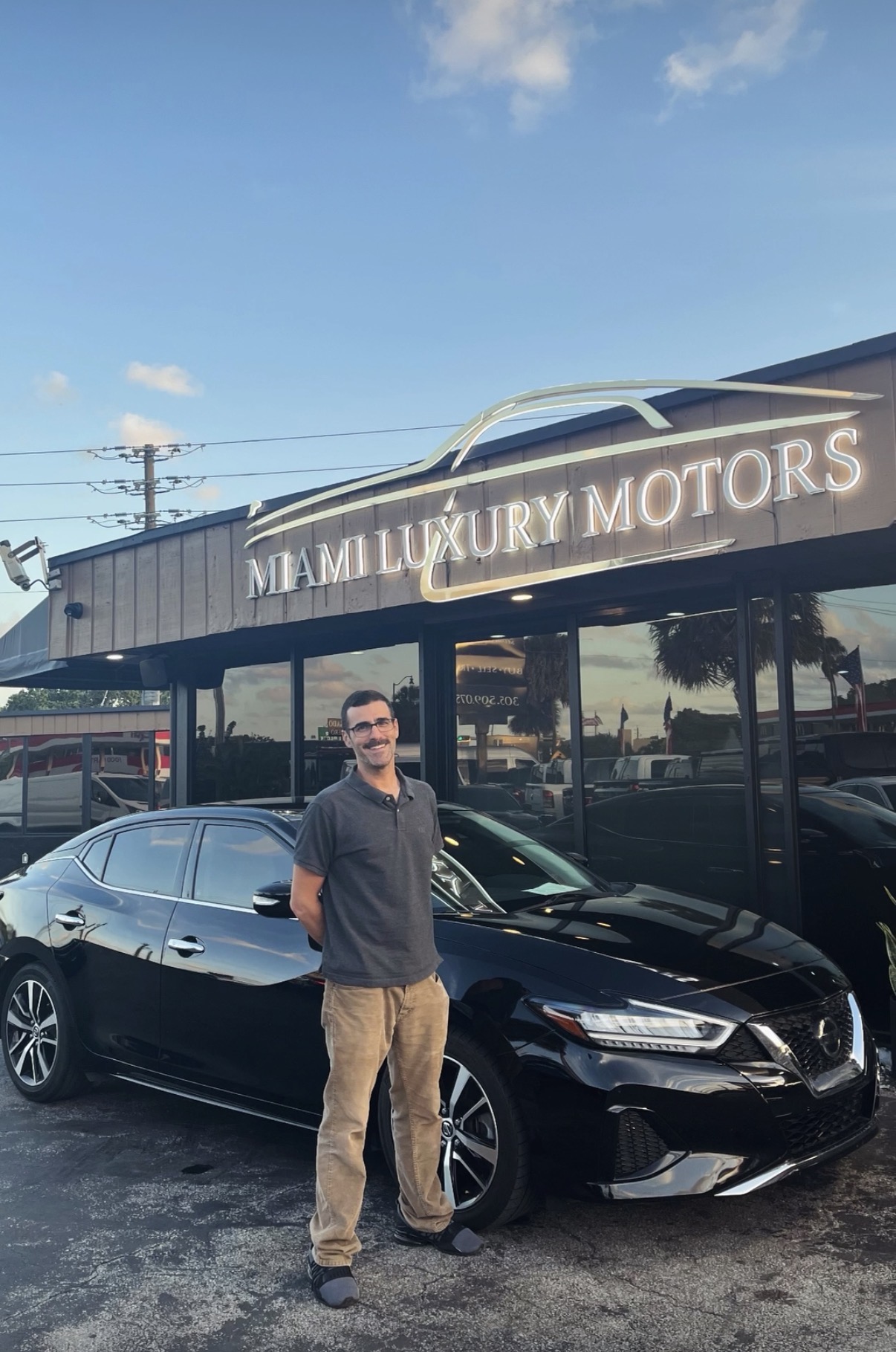 Carlos M. with their Nissan Maxima