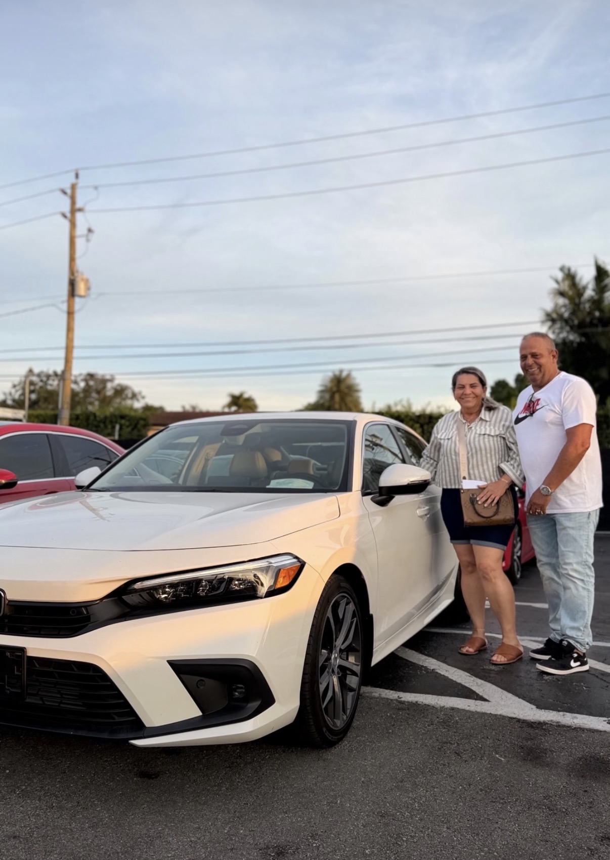 Mr. & Mrs. Hernandez with their Honda Civic Touring