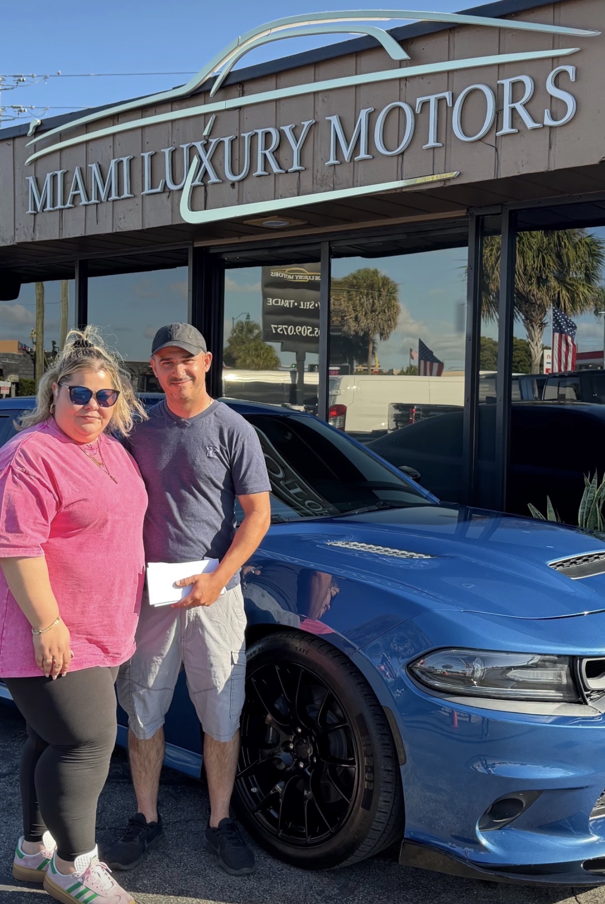 Mr. & Mrs. Rivera with their Dodge Charger